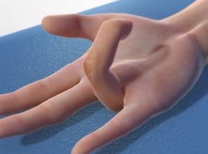Close-up of a hand with a unique finger position, showcasing flexibility and artistic hand gesture on a blue textured surface, ideal for dance, yoga, or fitness themes.